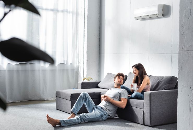 couple enjoying the air conditioner