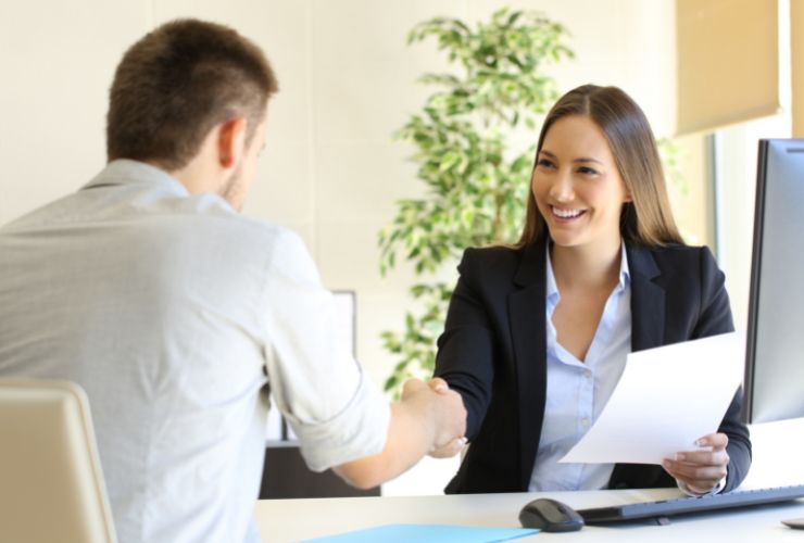 business man and business woman shaking hands