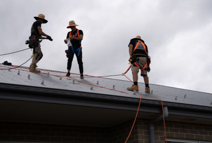 Local solar installers working on roof