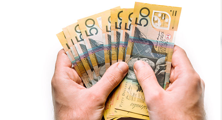 a pair of hands holding cash