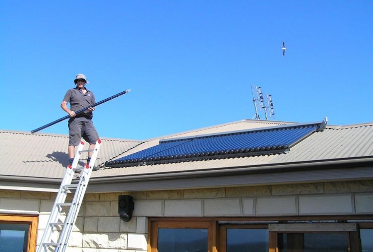 installer working on roof