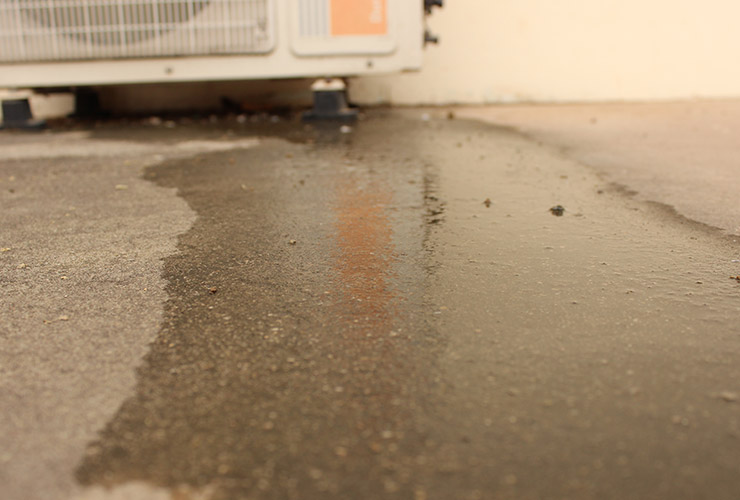 water flowing from outdoor air conditioning unit