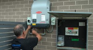 installer working on inverter