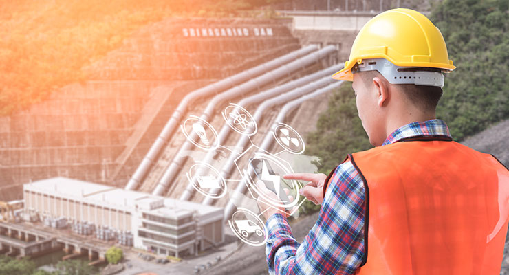 person with hard hat using phone