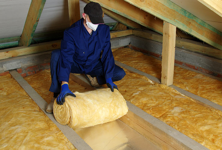 insulation being installed in specific place in home