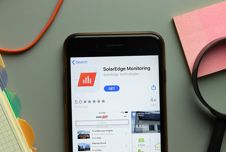 olarEdge Monitoring mobile app logo on phone screen close up