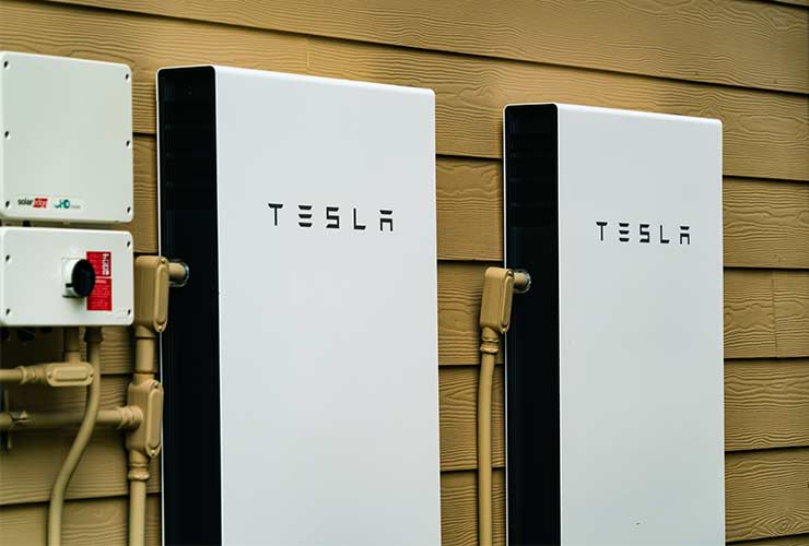 two Tesla solar batteries mounted exterior to the house