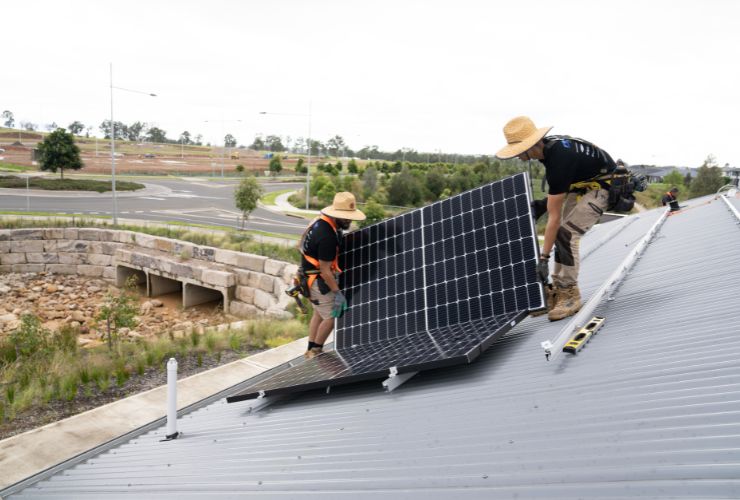 two installers working on roof 