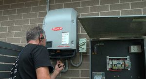 installer working on inverter