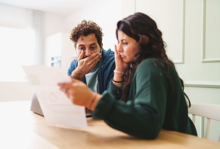 couple looking at their energy bill