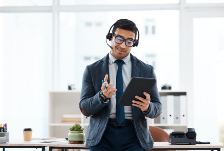 man with headset on making sales call