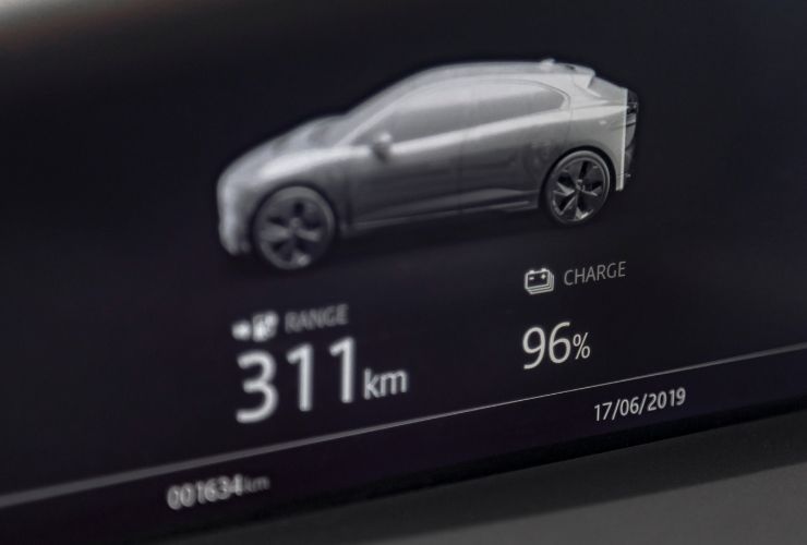 electric vehicle dashboard showing EV charged by fast charging