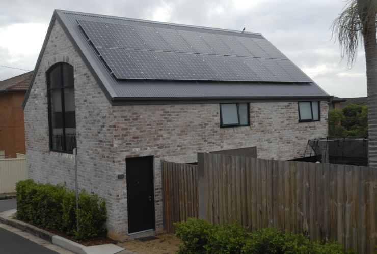 residential house with solar panels on it that are now cheaper than what they used to be
