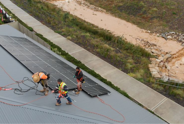 installers working on roof that is good for solar panels