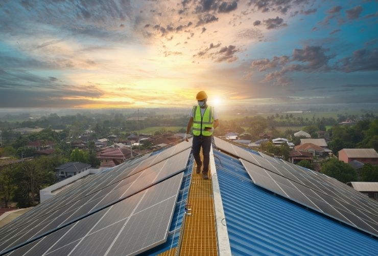 installer walking on roof and replacing existing solar system