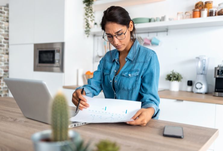 boom in renewable energy causing woman to look at electricity bill differently