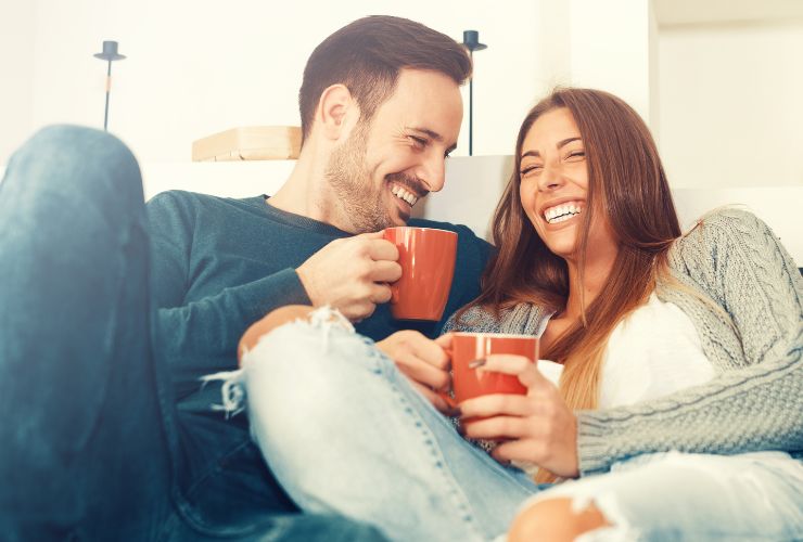 couple laughing on couch