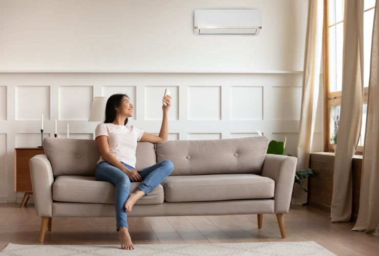 Girl Using Air Conditioner which has been serviced