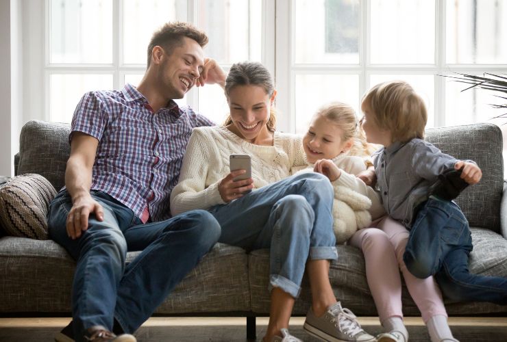 Family looking at social media on phone