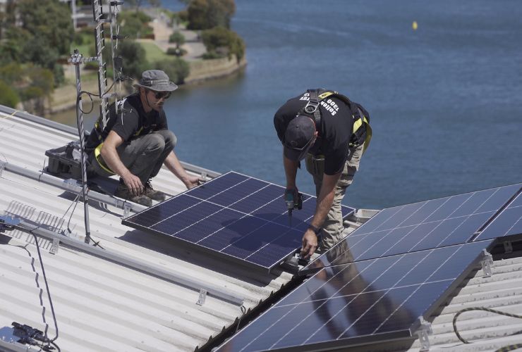 installer working on solar panel