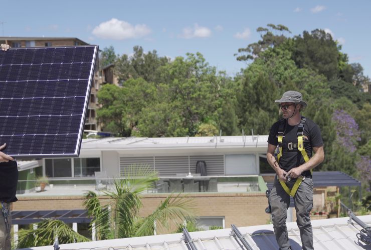 solar installer on roof