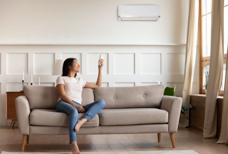 woman enjoying air conditioner