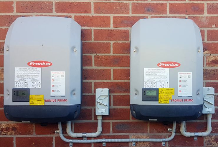 two inverters on wall for an oversize solar system