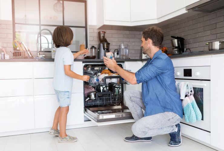 man using dishwasher