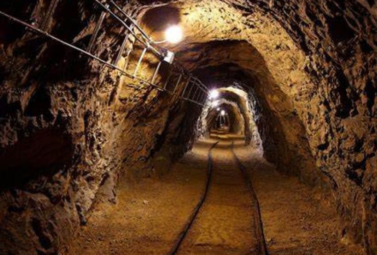 Undergound mining railway tunnel lit up