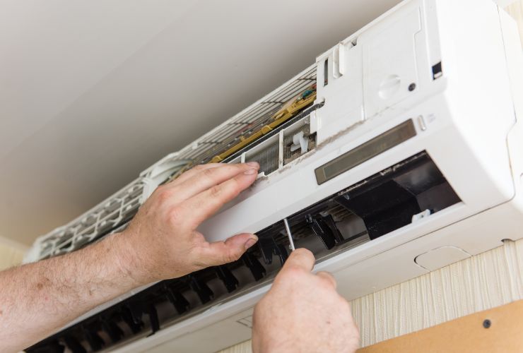 installer working on air conditioner