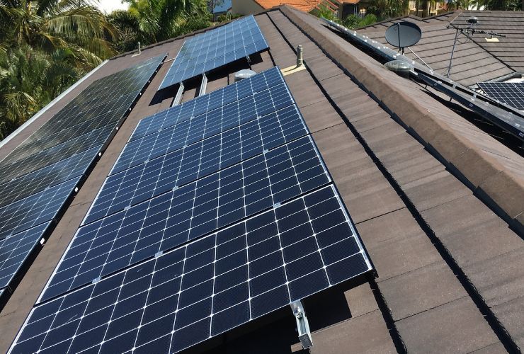 solar panels placed flat on a slate tiled roof