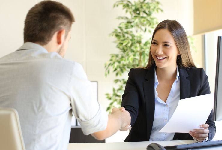 woman and man shaking hands