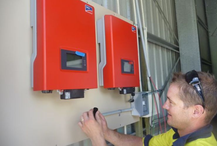 Man Installing quality inverter to help choose a good inverter solution 