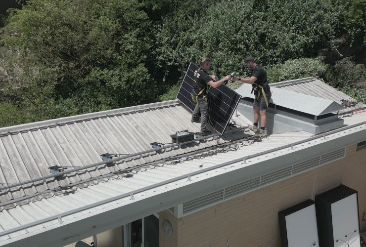 solar installers working on roof, who have a licence to sell and install solar