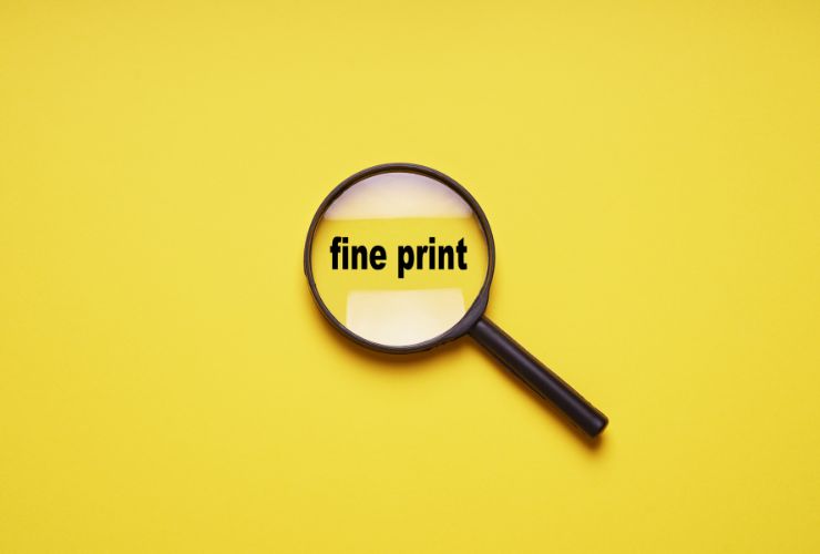 magnifying glass looking at fine print