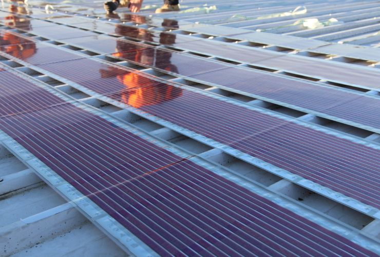 Printed solar being installed on a commercial roof
