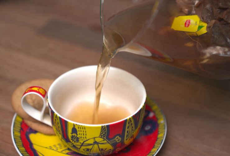 tea being poured in a cup