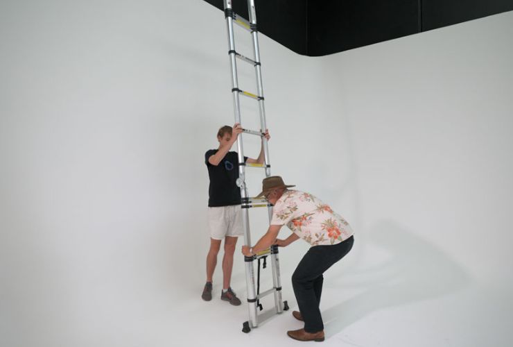 Markus and Jono extending a telescopic ladder