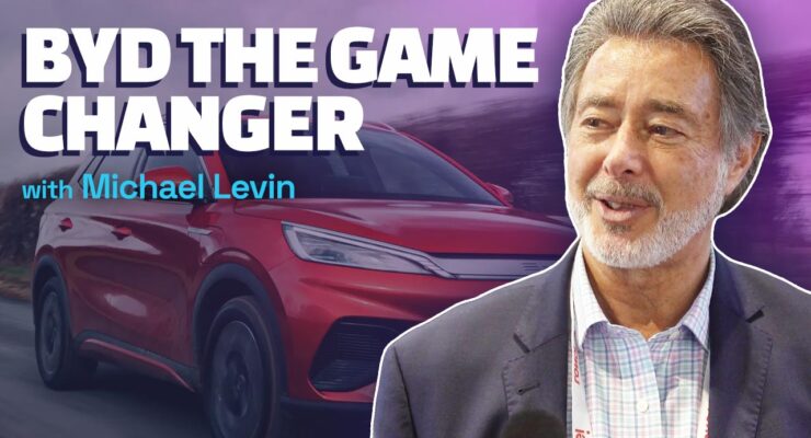 thumbnail of Michael Levin in front of BYD car