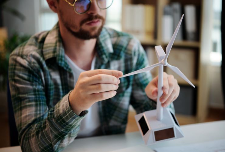 man holding mini turbine