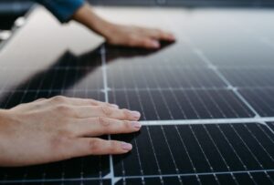 hand on solar panel