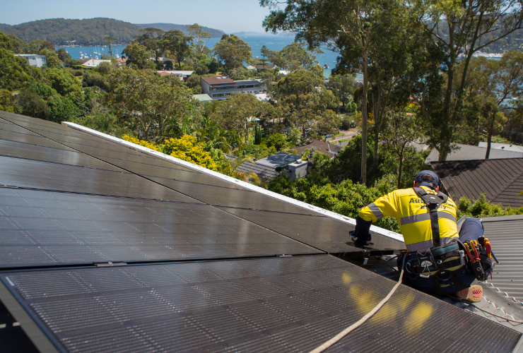 solar panel installer on roof